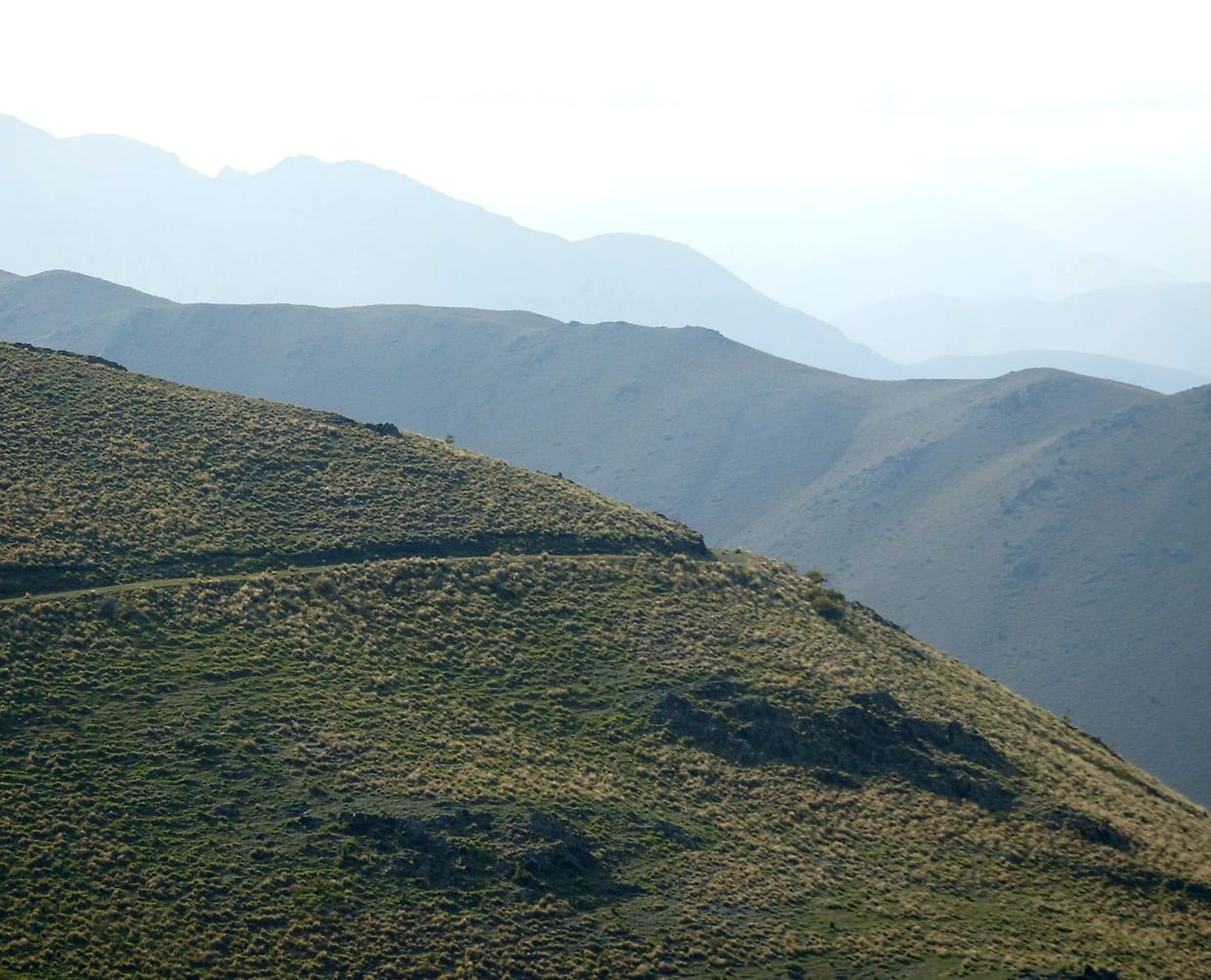 Layered high country ridges receding into the haze